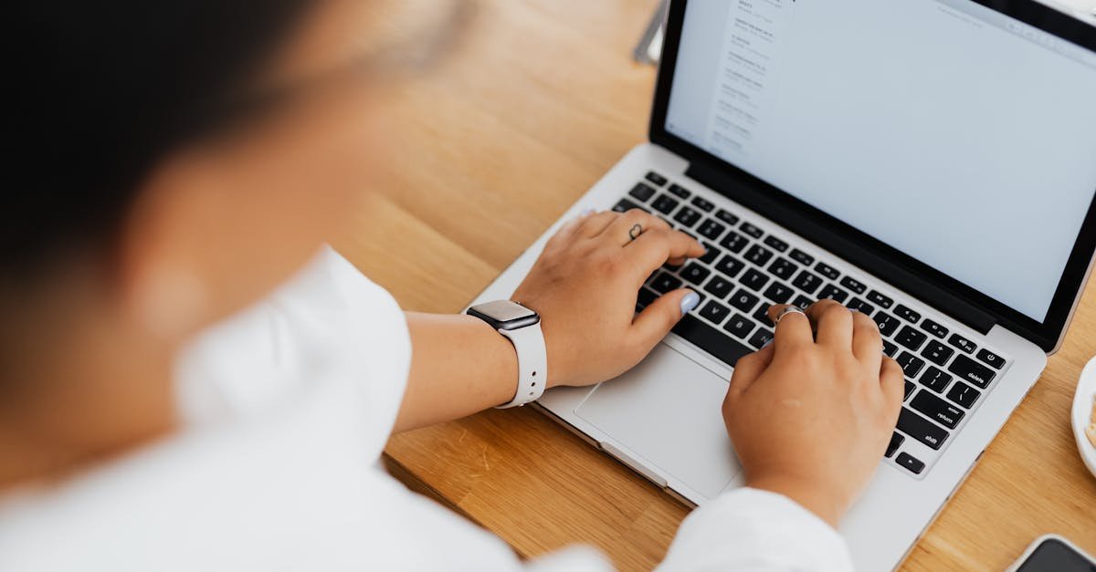 Writing a cold outreach email on a laptop