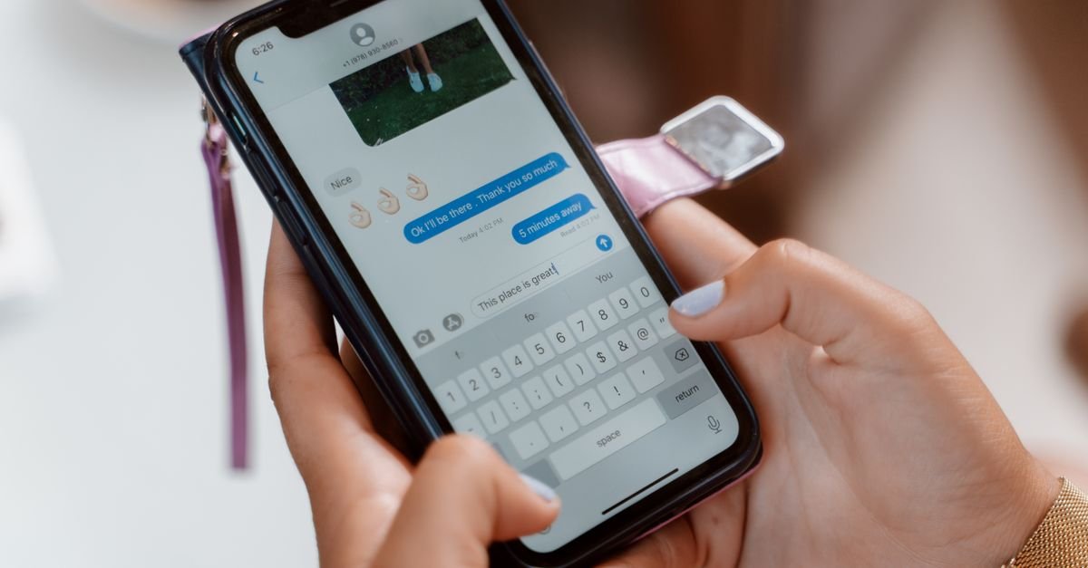 Writing a social media caption on a phone